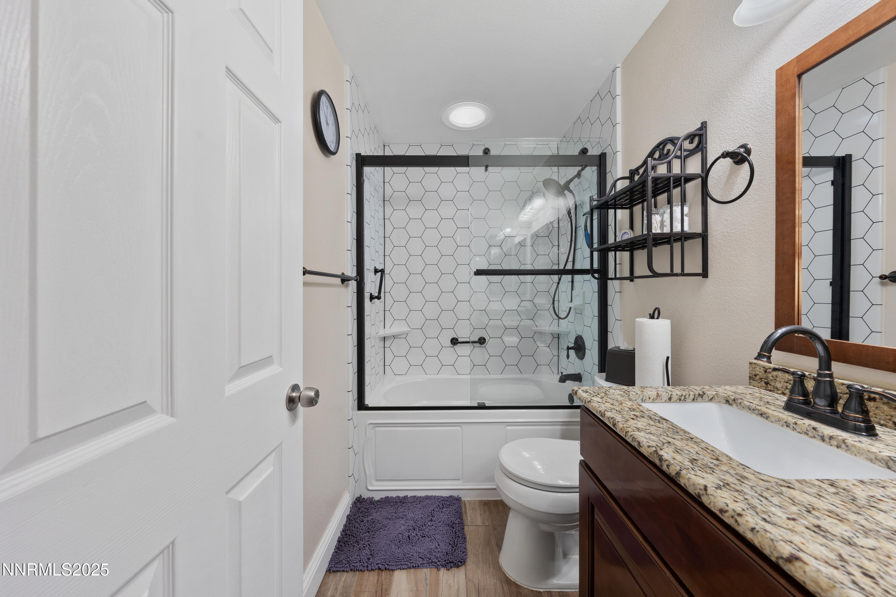 17785 Fortune Court Reno, NV 89508 - Photo 28 of 43 a bathroom with a granite countertop sink toilet and shower