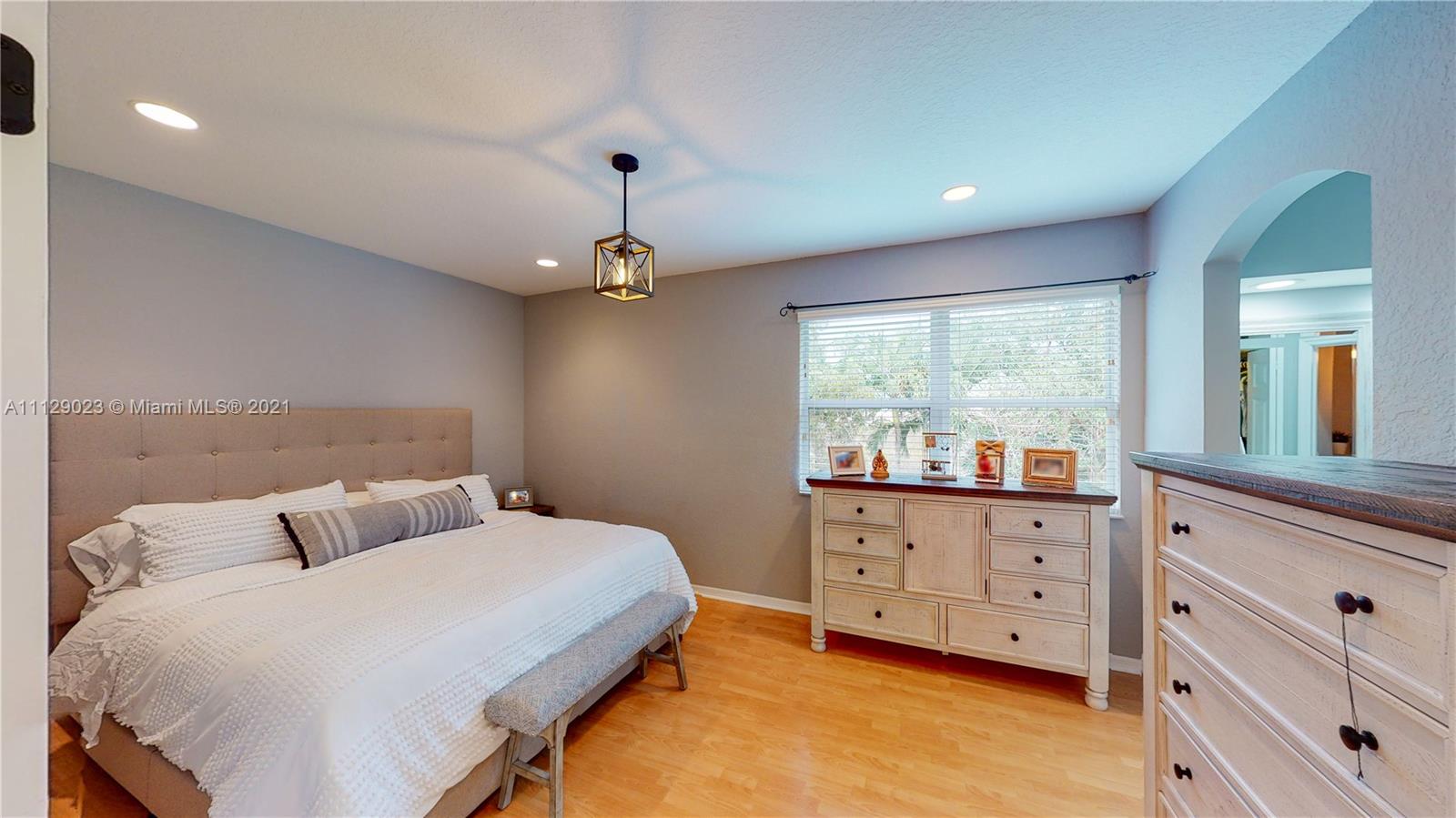 1399 Southeast 20th Road Homestead, FL 33035 - Photo 13 of 50 a bedroom with a bed and with furniture