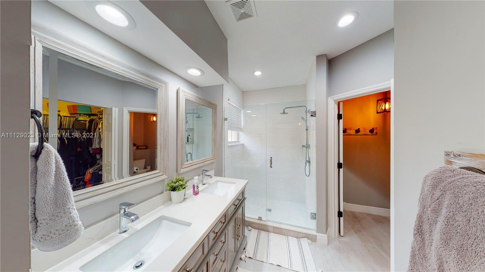 1399 Southeast 20th Road Homestead, FL 33035 - Photo 16 of 50 a bathroom with a bathtub sink and mirror