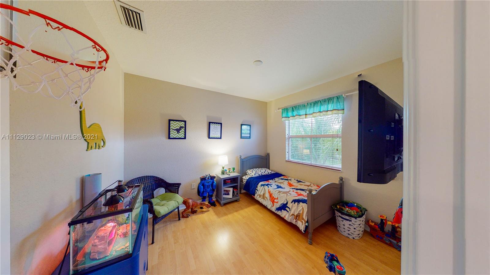 1399 Southeast 20th Road Homestead, FL 33035 - Photo 18 of 50 a bed room with a bed and a window