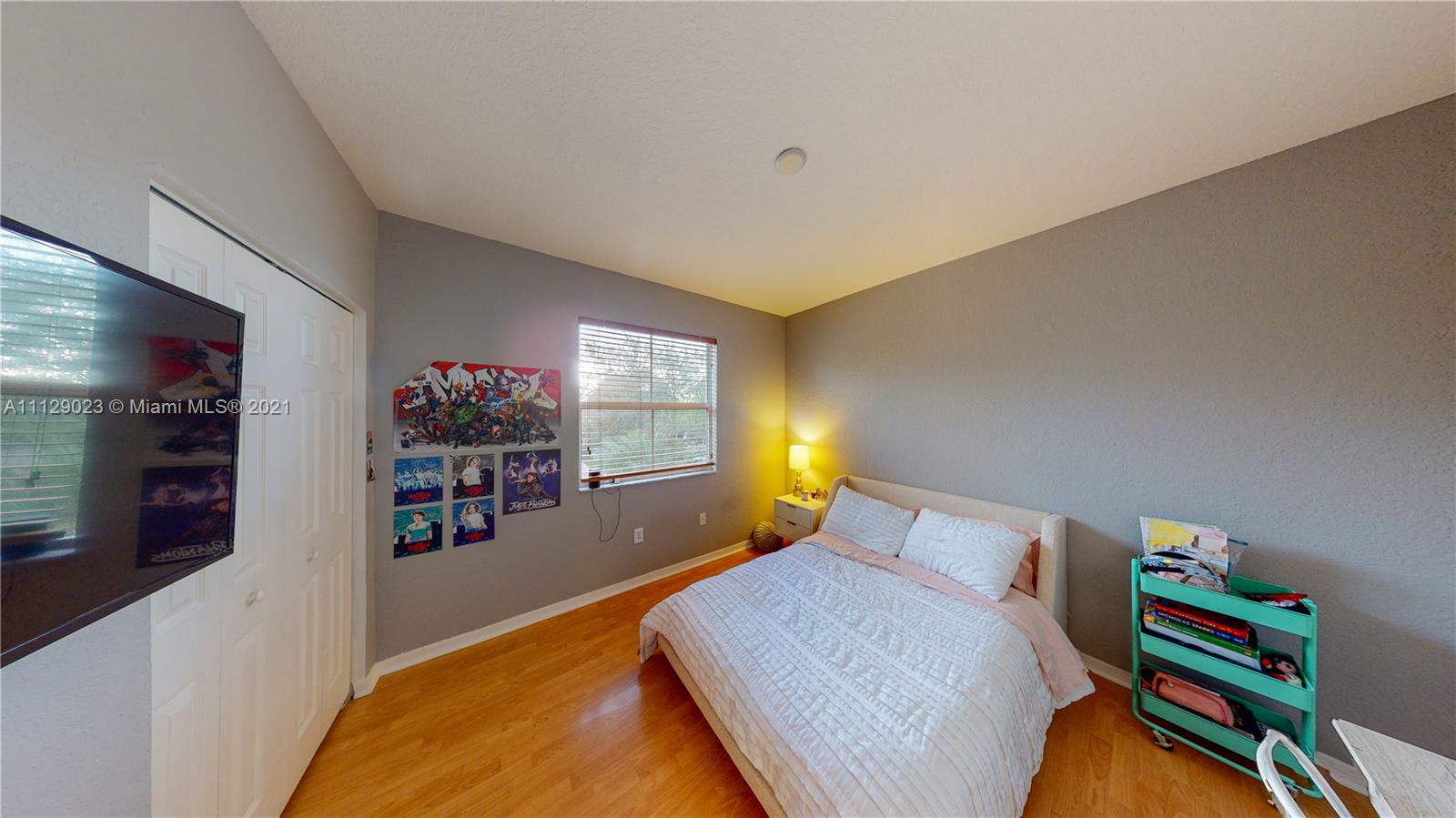 1399 Southeast 20th Road Homestead, FL 33035 - Photo 20 of 50 a bedroom with bed and a bookshelf