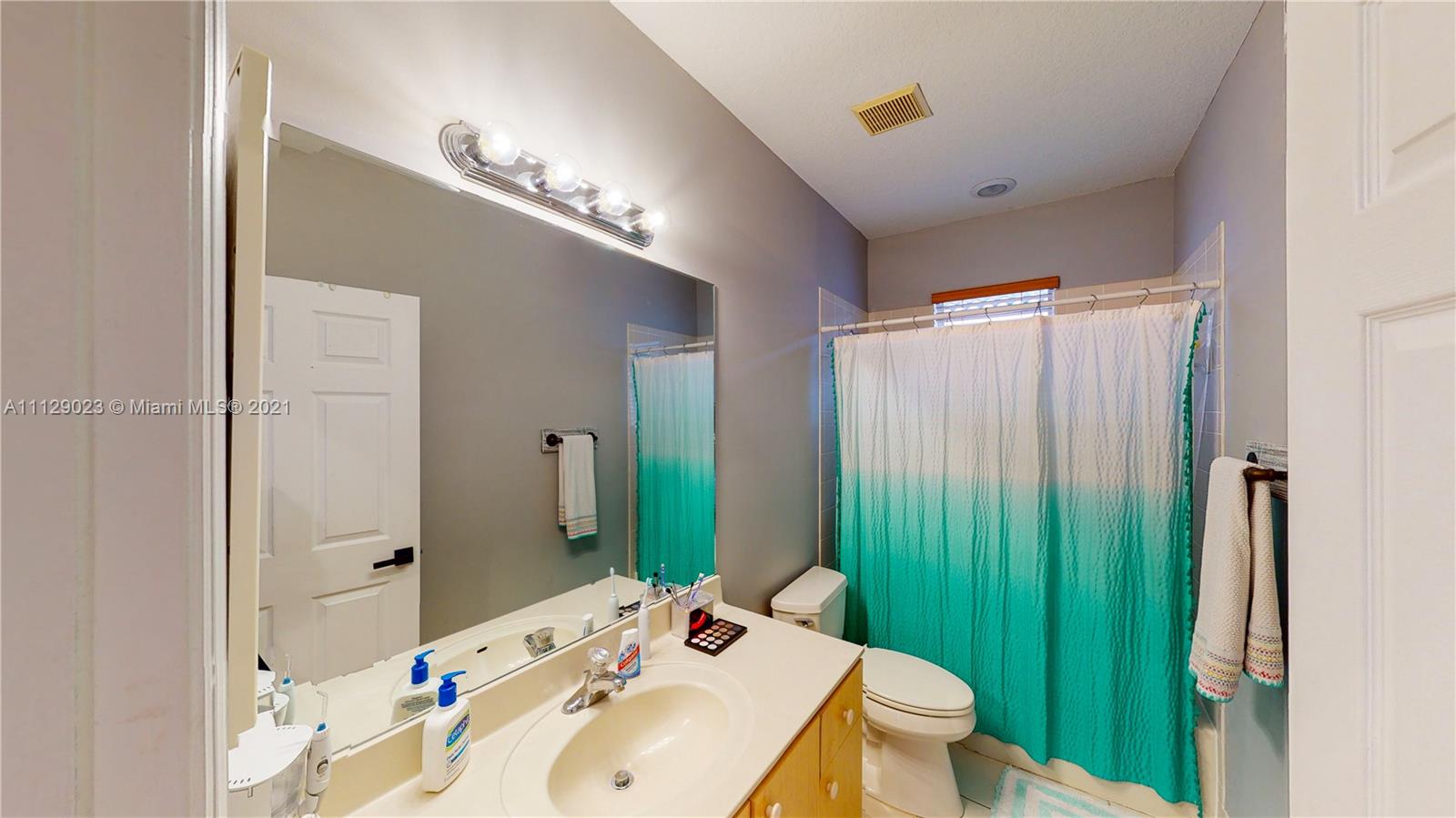 1399 Southeast 20th Road Homestead, FL 33035 - Photo 21 of 50 a bathroom with a sink a toilet and shower