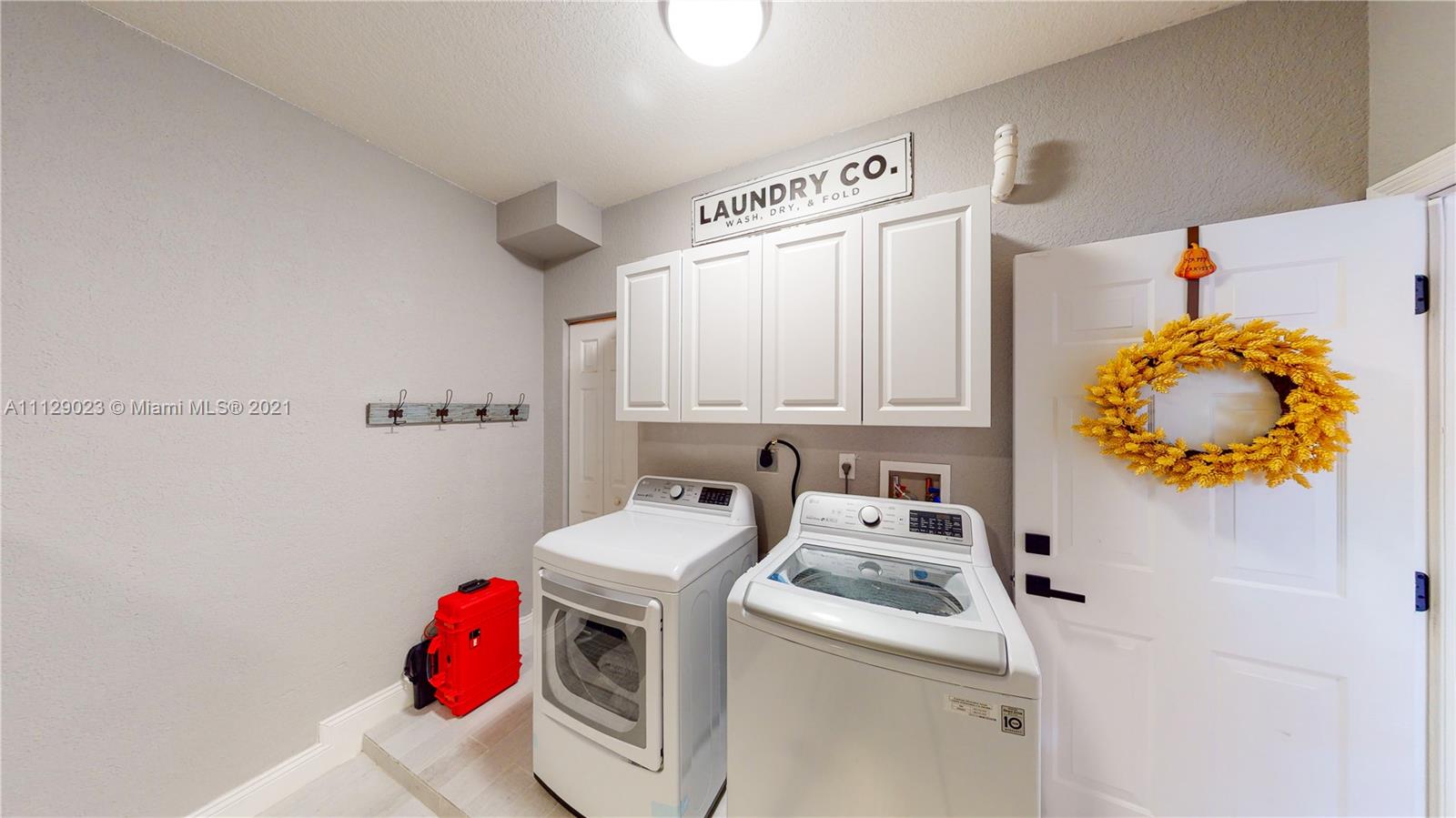 1399 Southeast 20th Road Homestead, FL 33035 - Photo 24 of 50 a utility room with dryer and washer