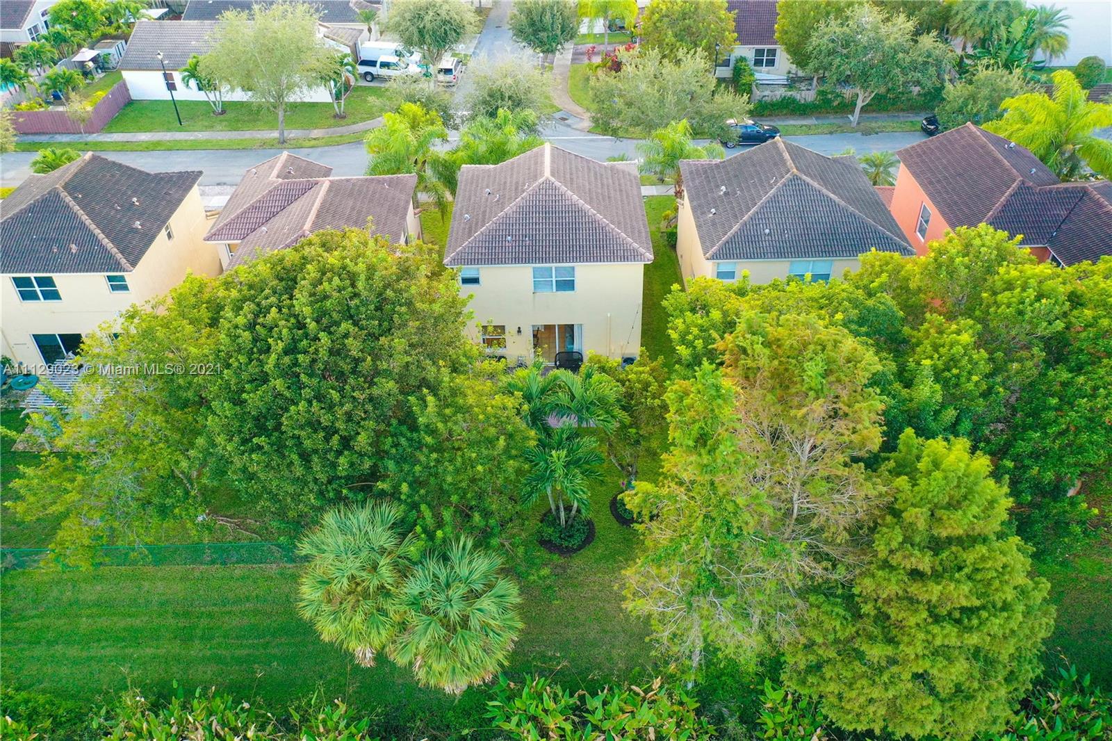 1399 Southeast 20th Road Homestead, FL 33035 - Photo 35 of 50 an aerial view of a house with yard and green space
