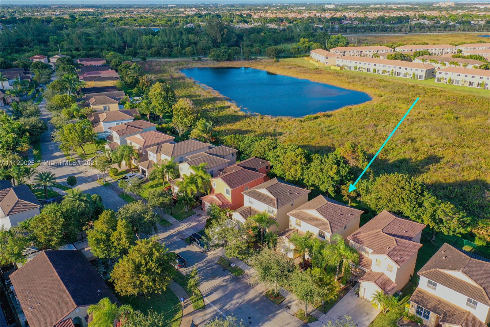 1399 Southeast 20th Road Homestead, FL 33035 - Photo 38 of 50 an aerial view of residential houses with outdoor space and swimming pool