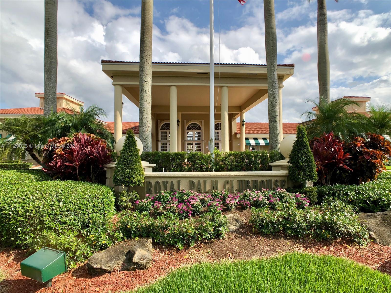 1399 Southeast 20th Road Homestead, FL 33035 - Photo 40 of 50 a front view of a house with a yard and potted plants
