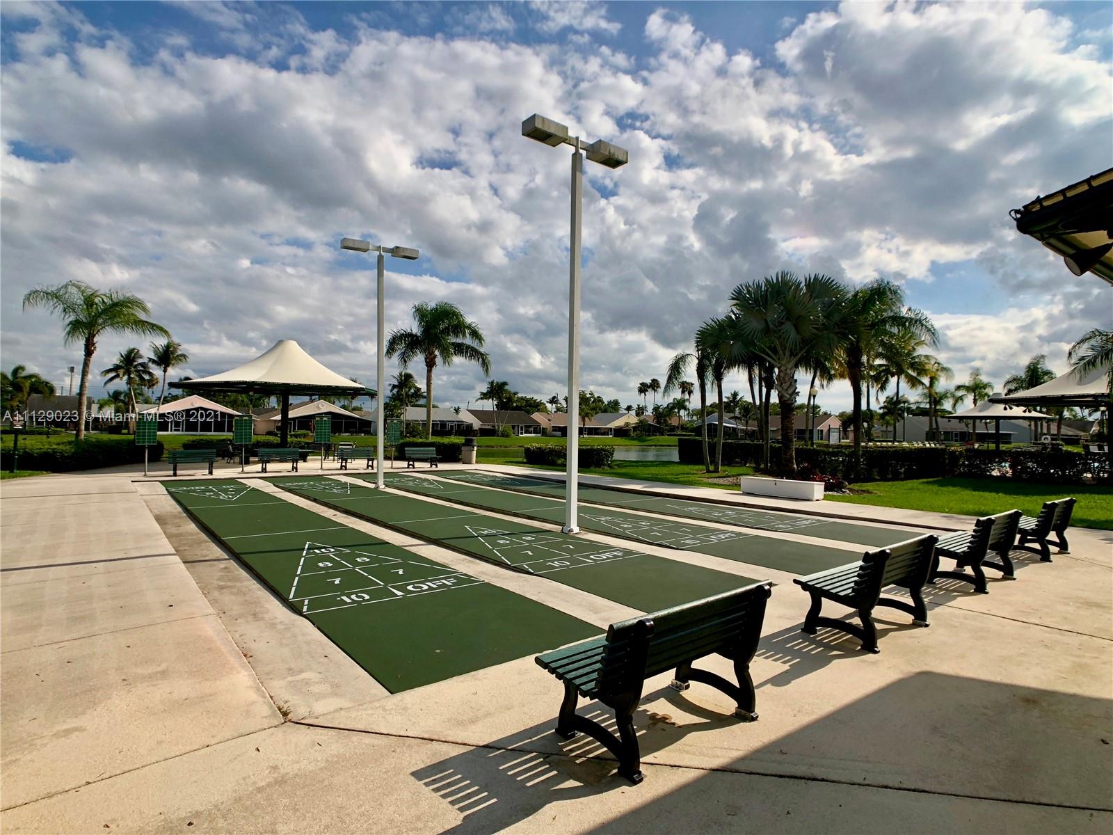 1399 Southeast 20th Road Homestead, FL 33035 - Photo 47 of 50 a view of a patio with a table and chairs