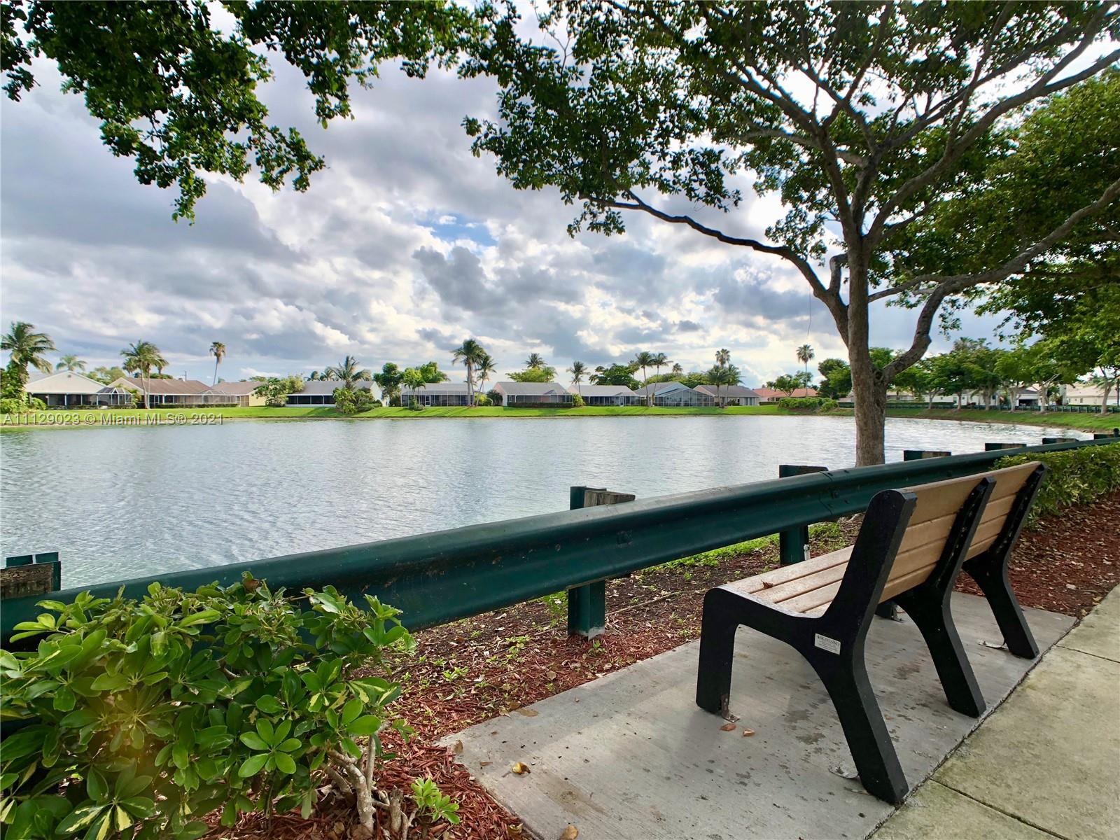1399 Southeast 20th Road Homestead, FL 33035 - Photo 50 of 50 a lake view with a bench and lake view