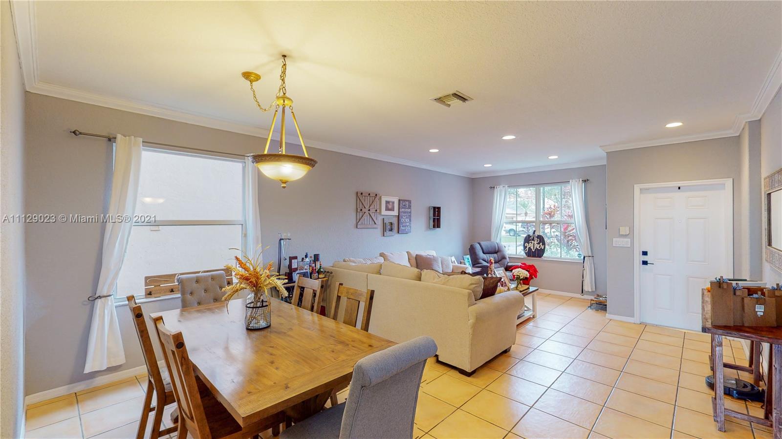 1399 Southeast 20th Road Homestead, FL 33035 - Photo 6 of 50 a view of a dining room with furniture