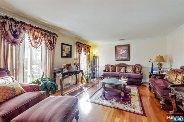 a living room with furniture and a rug