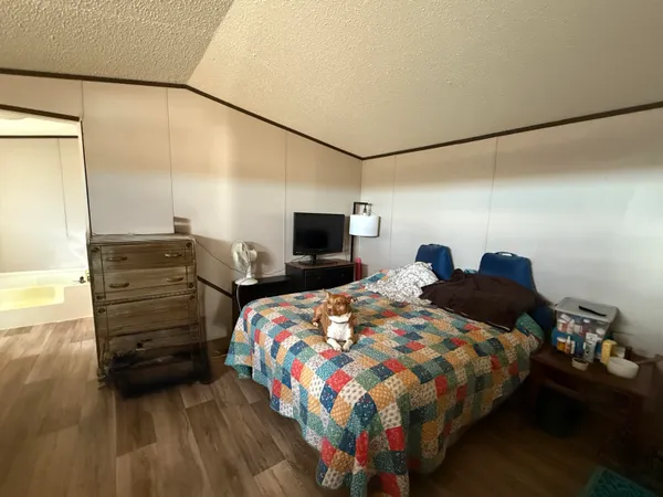 a bedroom with a bed and furniture