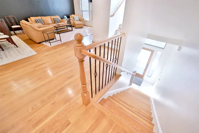 a view of a bedroom with wooden floor