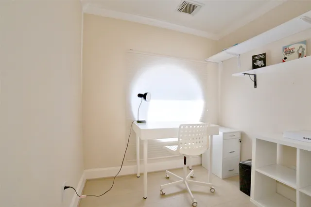 a living room with a table and chairs