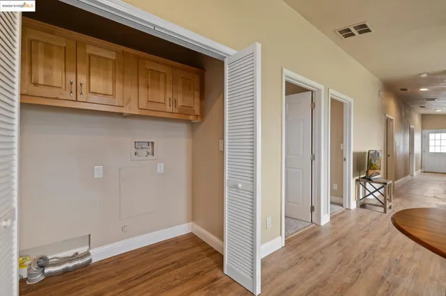 a view of a kitchen from the hallway