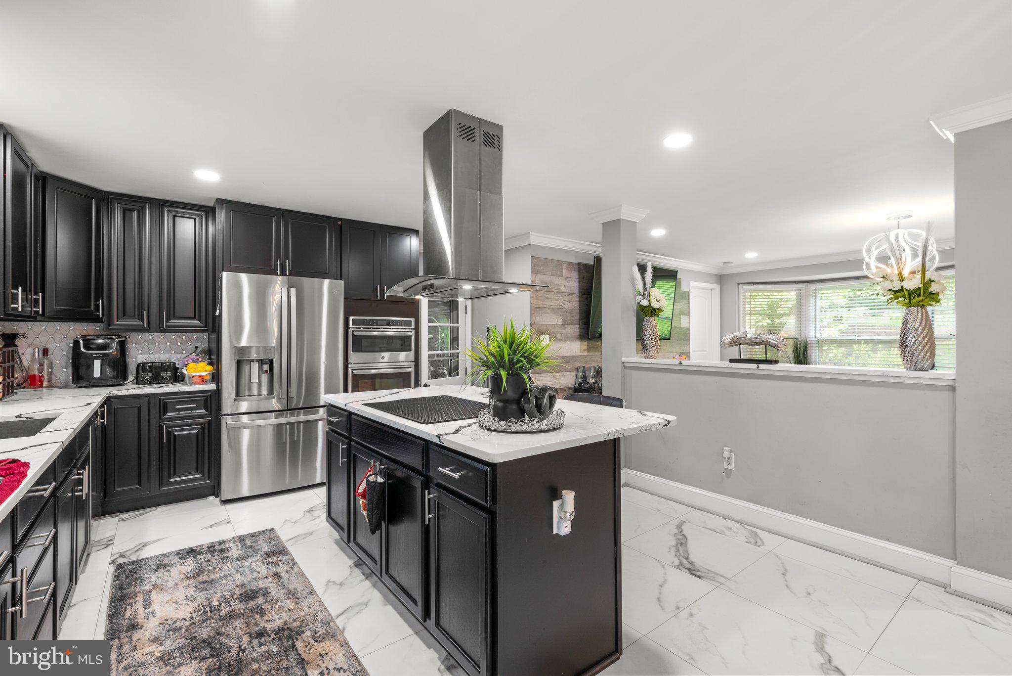 13922 Sunnybrook Road Phoenix, MD 21131 - Photo 8 of 32 Black kitchen cabinets with SS steal appliances