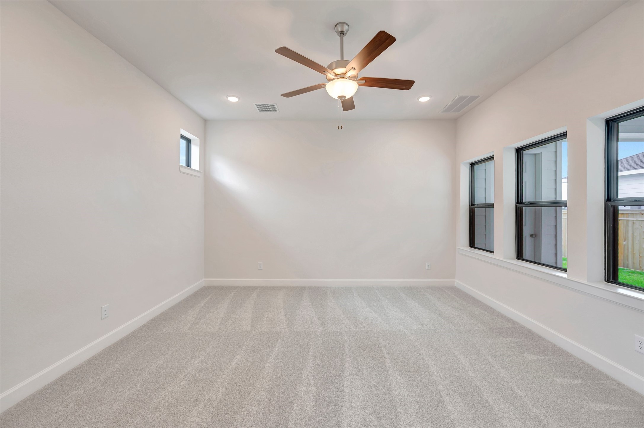 2718 Cottage Place Rosharon, TX 77583 - Photo 31 of 50 an empty room with closet and windows