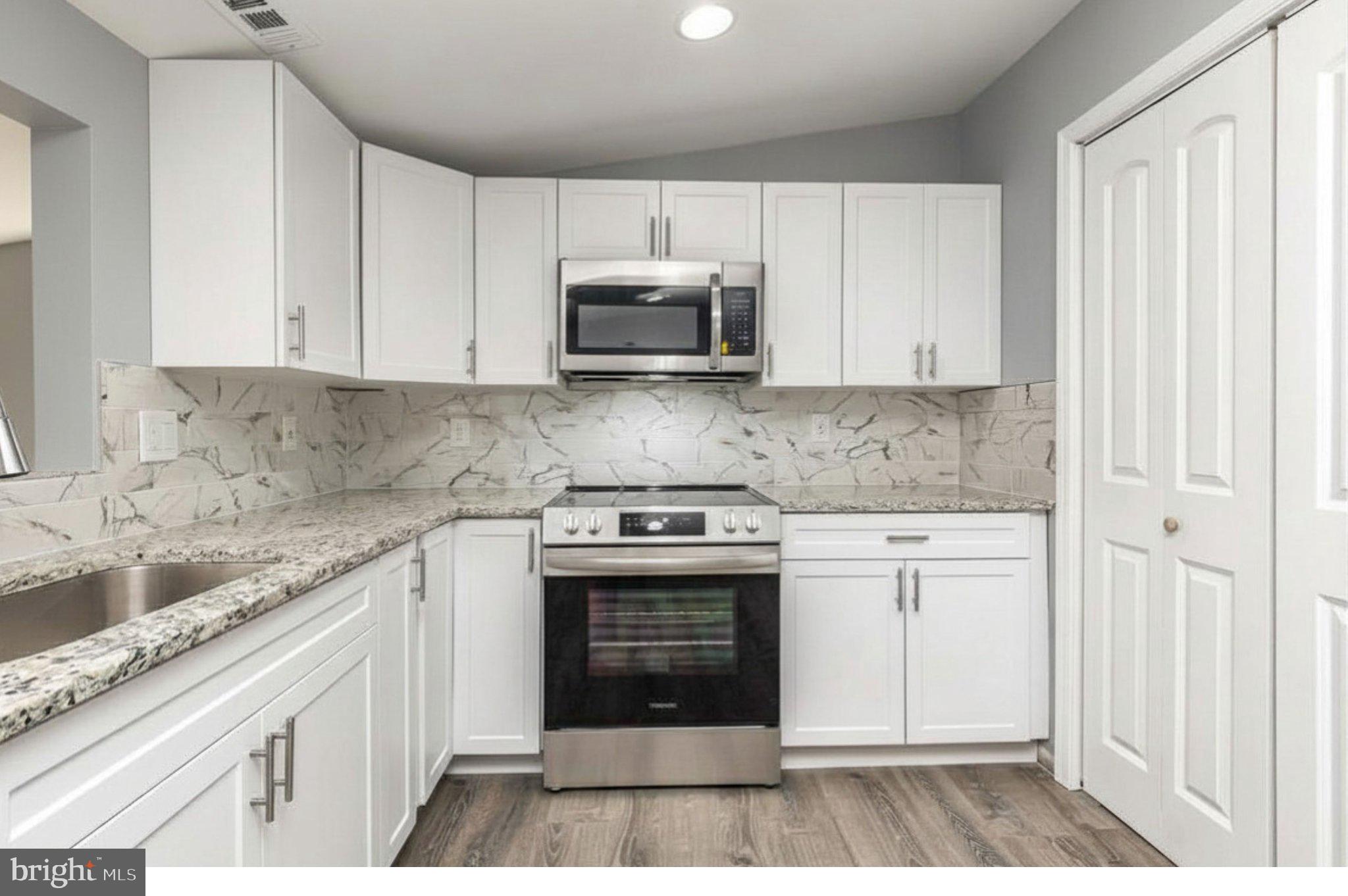17299 Monrovia Road Orange, VA 22960 - Photo 16 of 28 Modern kitchen with sleek finishes.