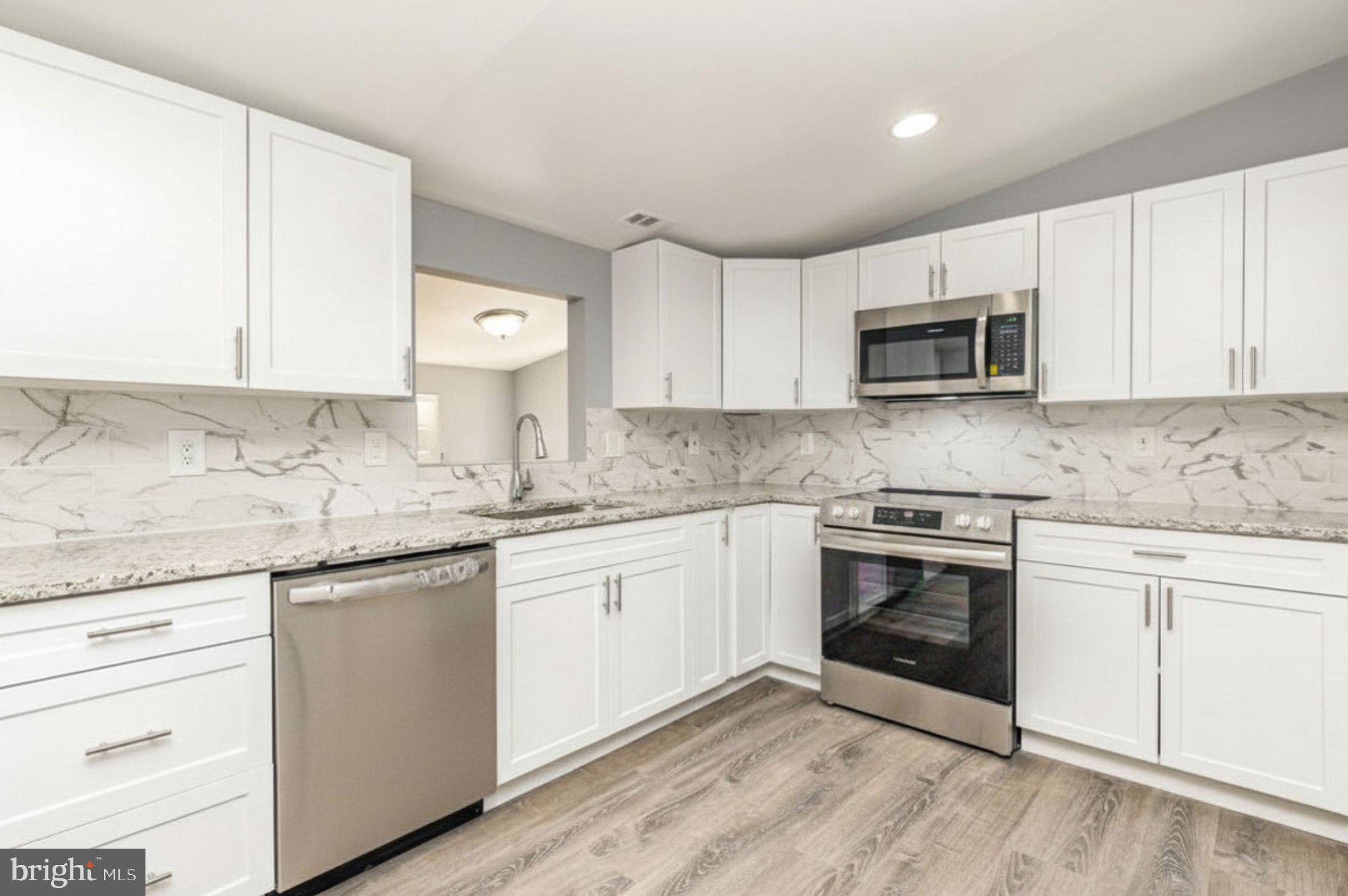 17299 Monrovia Road Orange, VA 22960 - Photo 17 of 28 Modern kitchen with sleek finishes.