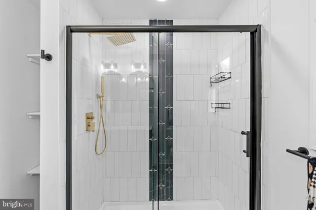 a bathroom with a glass shower door