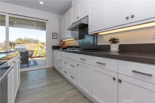 a bathroom with a toilet a sink and a mirror