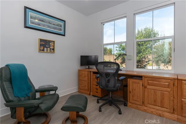 a view of a workspace with furniture