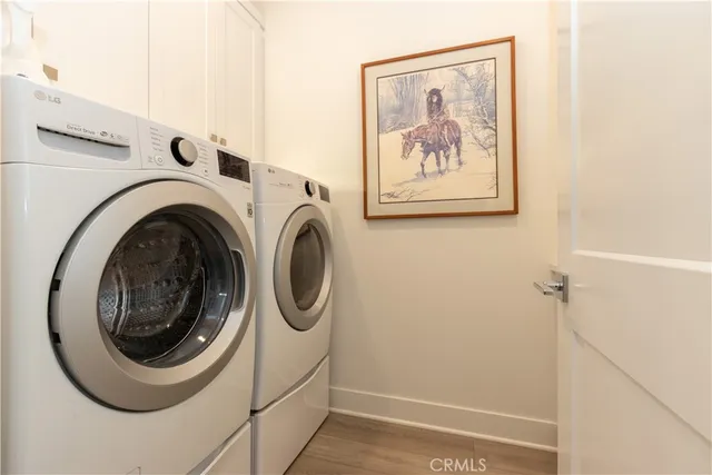 a view of a patio with table and chairs and potted plants