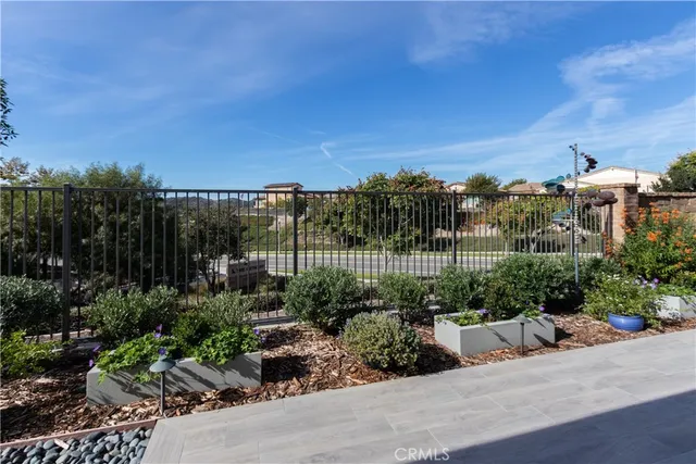 a view of a chairs and table in patio