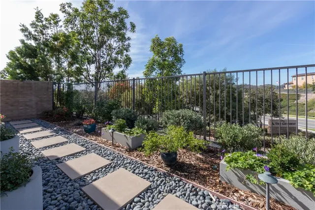 a view of a patio with couches and potted plants