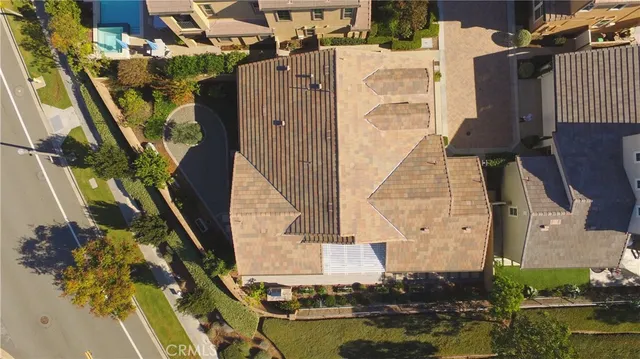 a view of a patio with couches table and chairs and potted plants