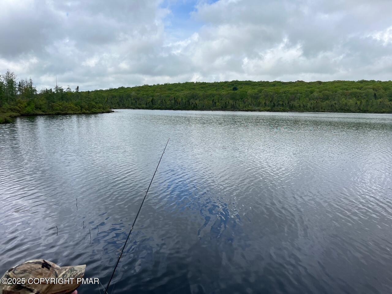 Undisclosed Address Dingmans Ferry, PA 18328 - Photo 22 of 22 a view of a lake from a yard