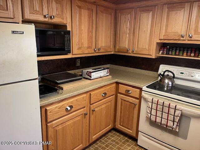 Undisclosed Address Dingmans Ferry, PA 18328 - Photo 5 of 22 a kitchen with granite countertop cabinets and black appliances