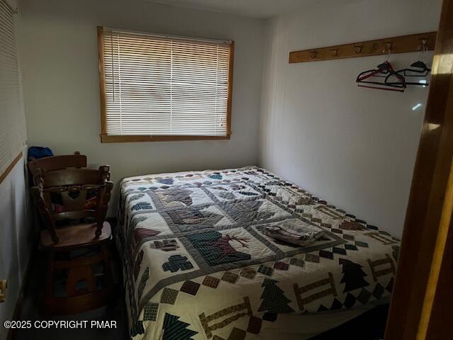 Undisclosed Address Dingmans Ferry, PA 18328 - Photo 10 of 22 a bedroom with a bed and a closet