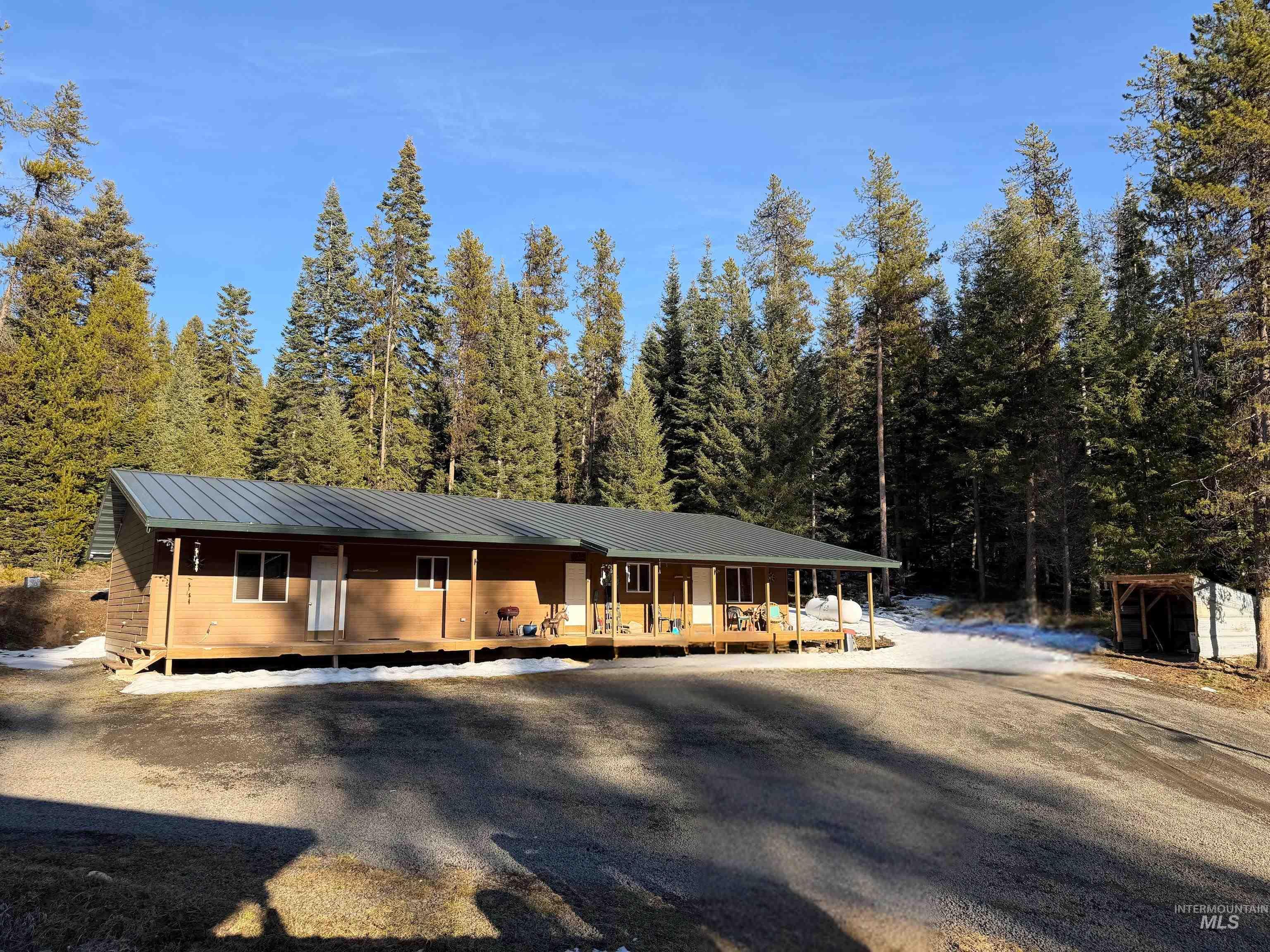 1400 Sweeney Hl Road Elk City, ID 83525 - Photo 1 of 39 View of front facade featuring covered porch and a metal roof