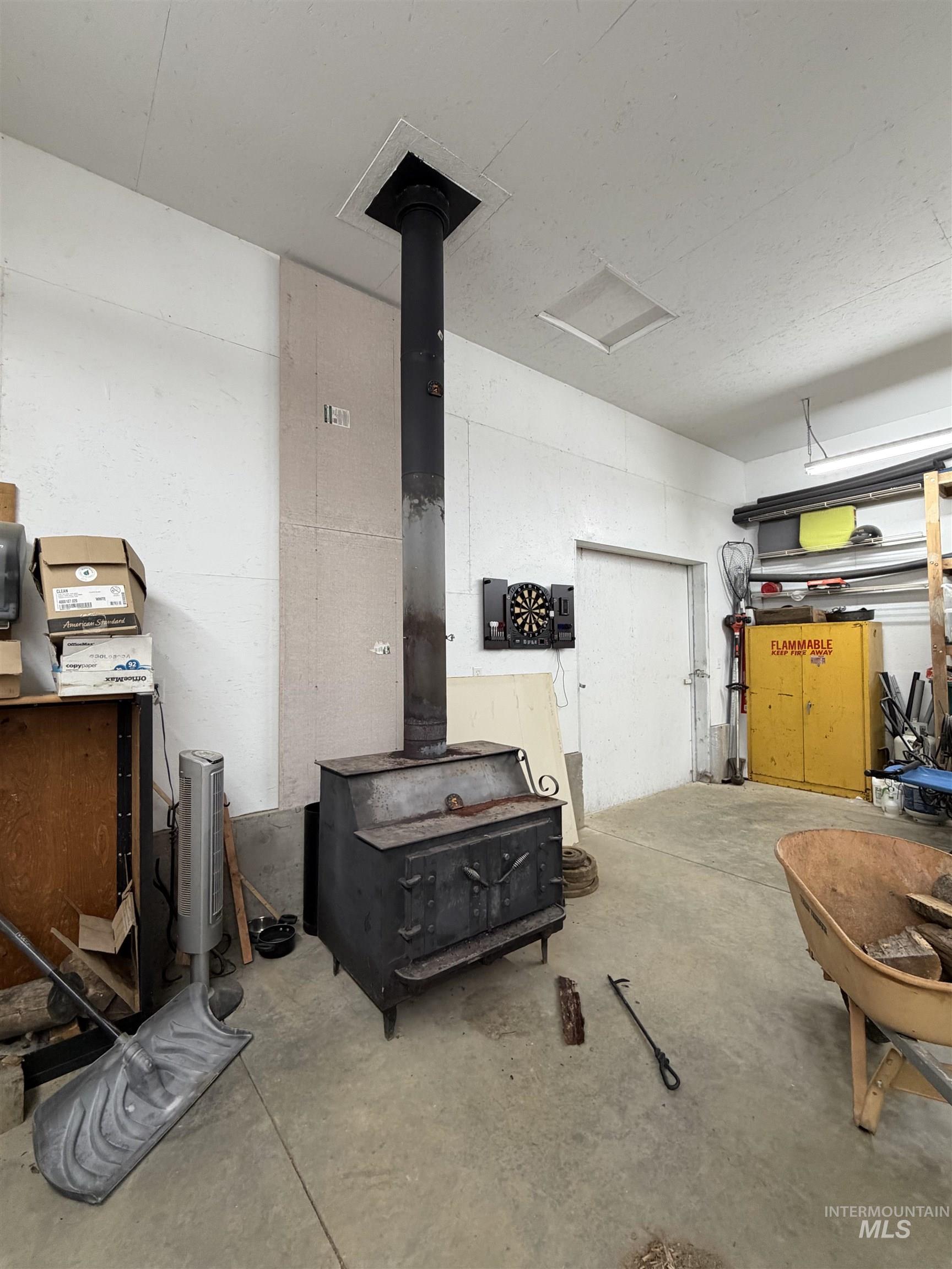 1400 Sweeney Hl Road Elk City, ID 83525 - Photo 35 of 39 Garage featuring a wood stove