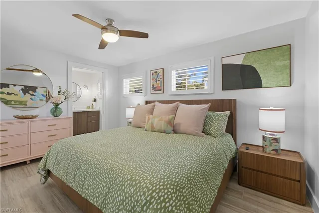 a bed room with a bed and a painting