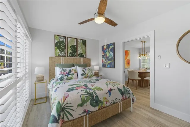 a bedroom with bed and a window