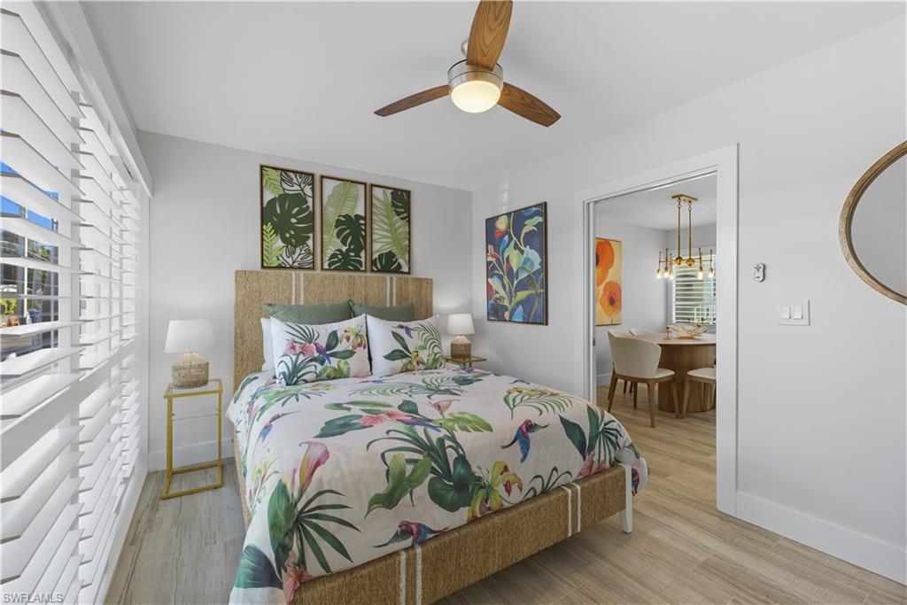 609 12th Avenue South, Unit 609 Naples, FL 34102 - Photo 18 of 32 a bedroom with bed and a window