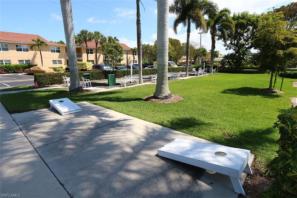 609 12th Avenue South, Unit 609 Naples, FL 34102 - Photo 29 of 32 a view of a park with palm trees