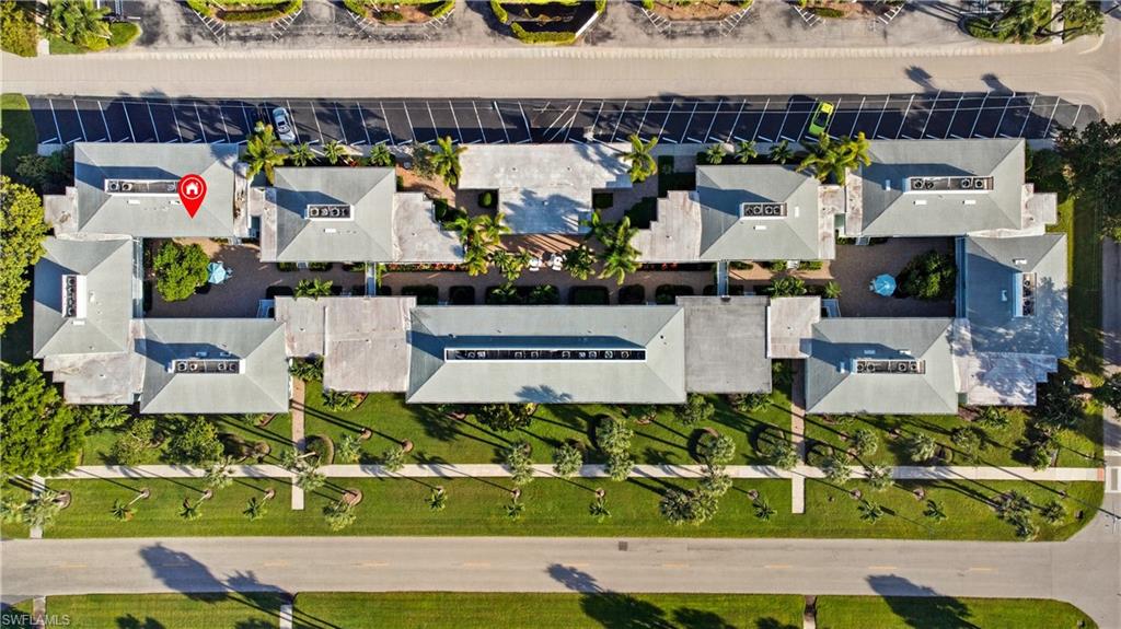 609 12th Avenue South, Unit 609 Naples, FL 34102 - Photo 32 of 32 an aerial view of a house with a swimming pool