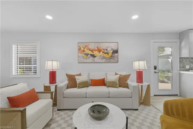 a living room with furniture and a window