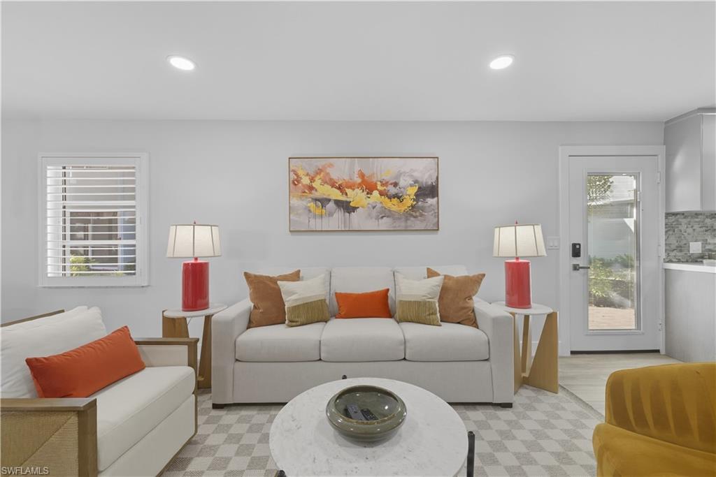 609 12th Avenue South, Unit 609 Naples, FL 34102 - Photo 8 of 32 a living room with furniture and a window