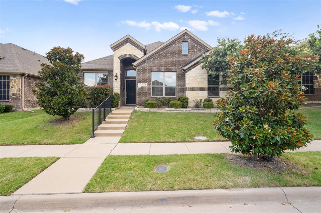 119 Happy Lane Red Oak, TX 75154 - Photo 2 of 37 Brick and stone facade with an arched entryway