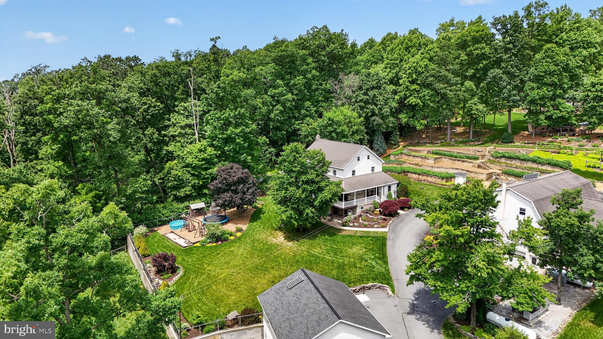 257 Hill Road New Holland, PA 17557 - Photo 10 of 94 Serene retreat amidst lush greenery.