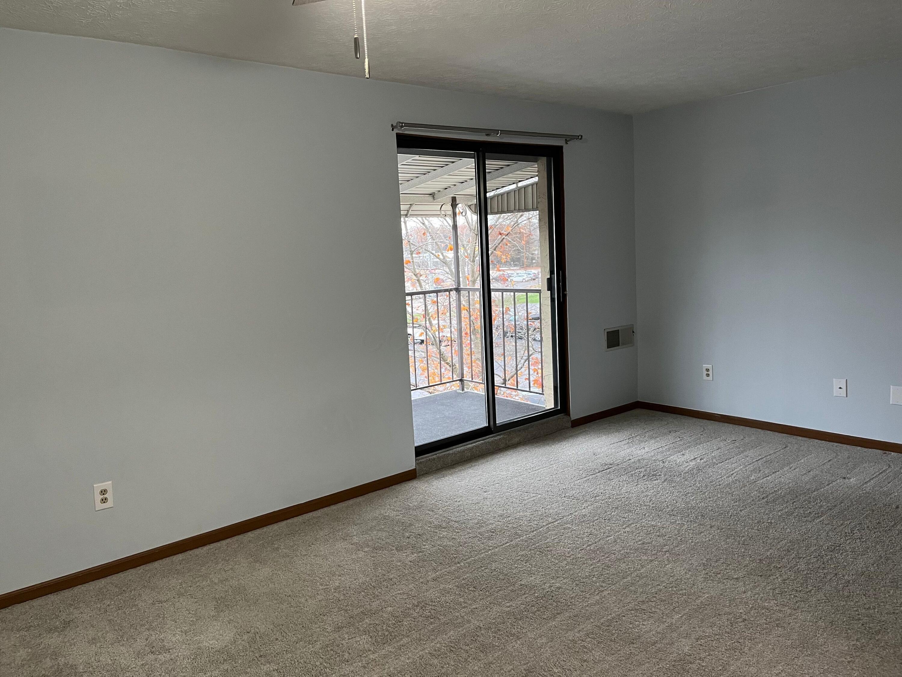 4115 Karl Road, Unit 309 Columbus, OH 43224 - Photo 7 of 45 Offers a slider to the covered balcony.