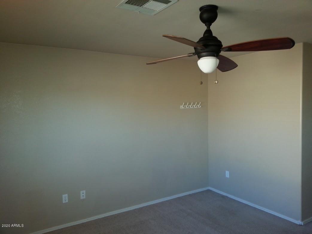 21817 North 40th Place Phoenix, AZ 85050 - Photo 14 of 25 a view of a room with a fan and wooden floor
