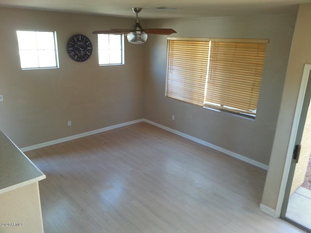 21817 North 40th Place Phoenix, AZ 85050 - Photo 5 of 25 a view of an empty room with a window