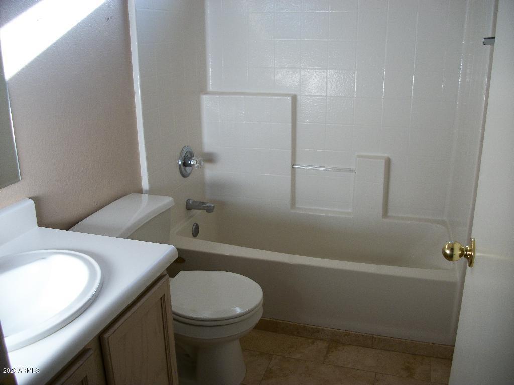 21817 North 40th Place Phoenix, AZ 85050 - Photo 6 of 25 a bathroom with a sink a toilet and shower