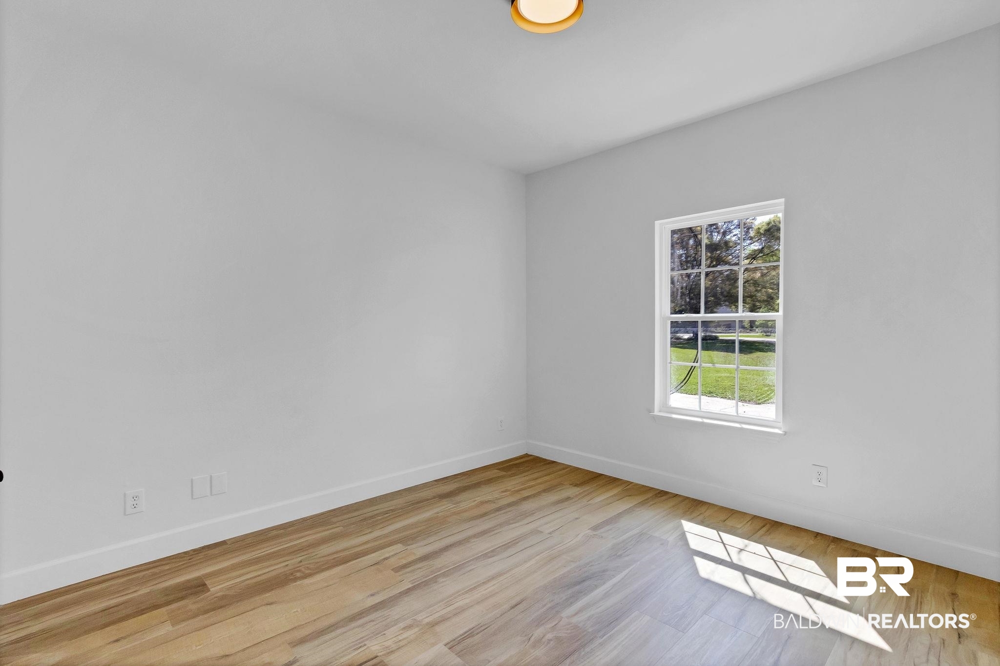 20265 Erin Pond Road Seminole, AL 36574 - Photo 40 of 97 Unfurnished room featuring baseboards and wood finished floors