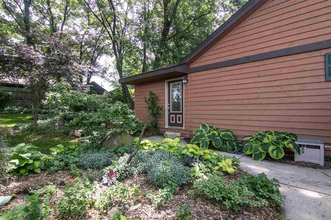 5477 Tate Road Rockford, IL 61101 - Photo 5 of 25 a view of a house with a yard and potted plants