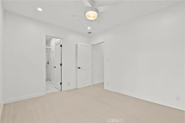 a view of a backyard with swimming pool and green space